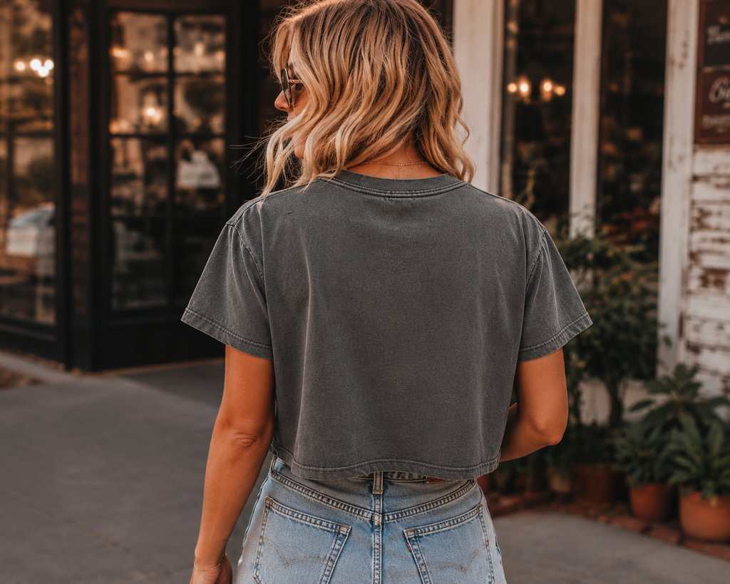 Back view of woman wearing Nashville Wild West Grey Stone boxy tee
