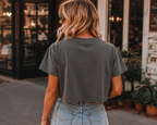 Back view of woman wearing Nashville Wild West Grey Stone boxy tee