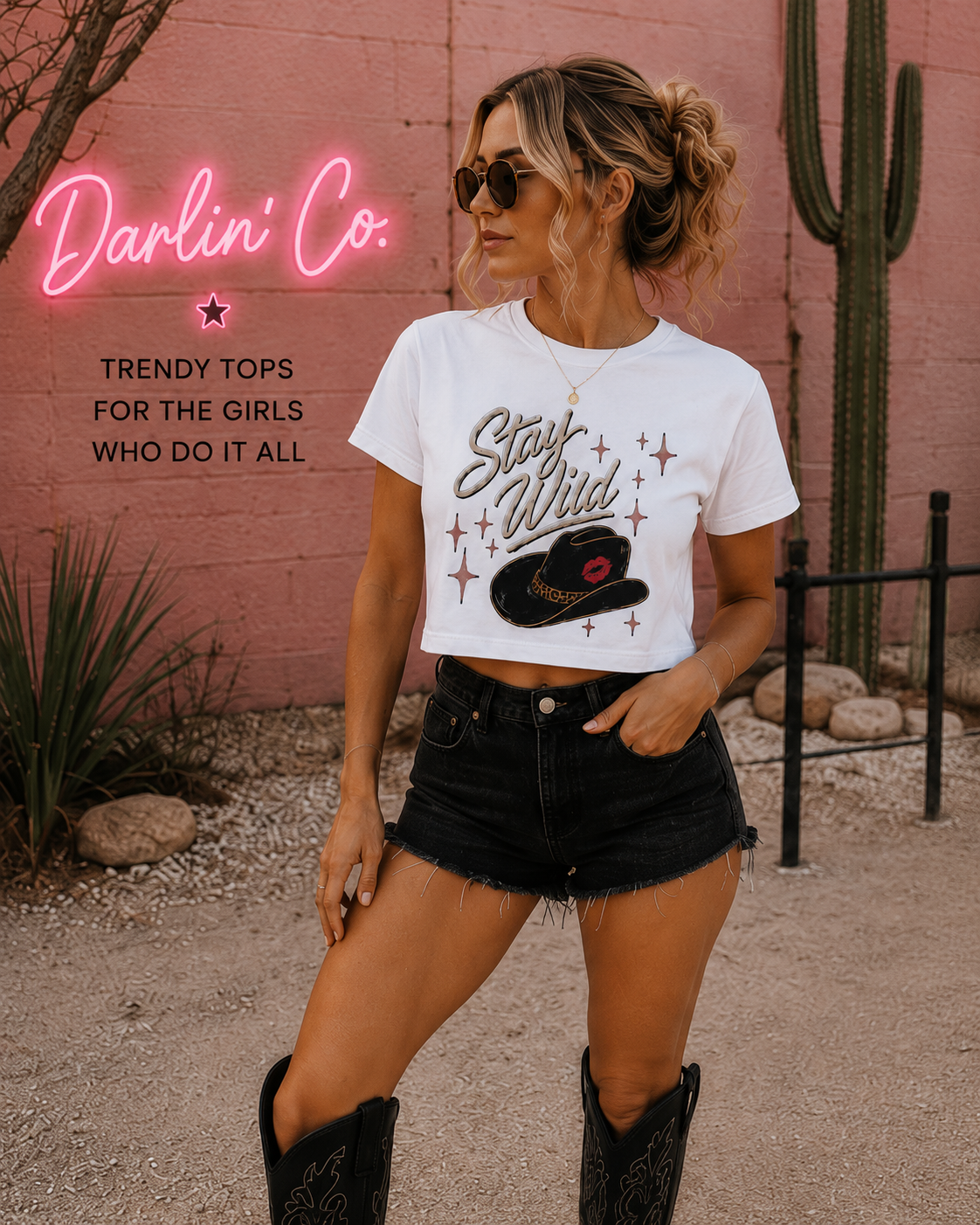 Blonde woman wearing white Stay Wild western crop tee