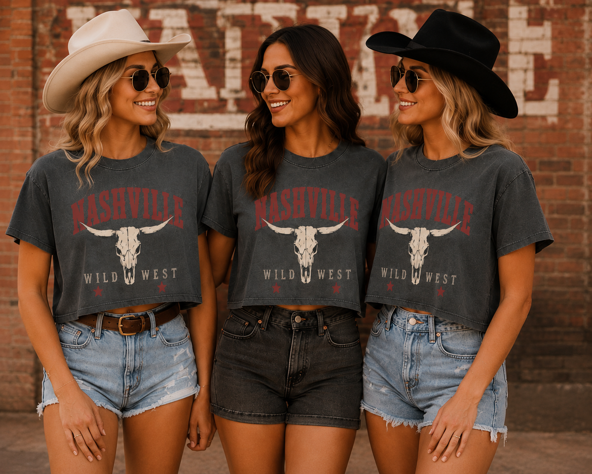 Three women wearing Nashville Wild West graphic crop tops in a western-inspired setting.