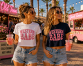 Two women wearing Western Babe crop tees in white and navy
