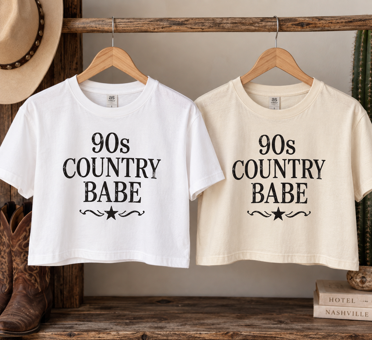 White and bone 90s Country Babe crop tees displayed on hangers