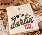 Howdy Darlin’ Vintage White crop tee laid flat showing black, leopard and hot pink graphic