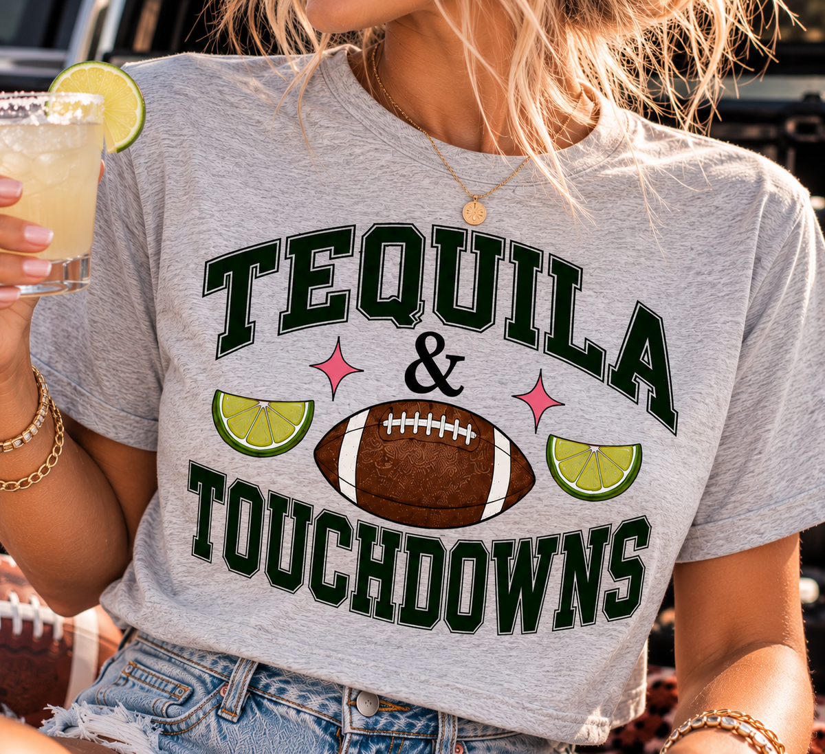 Close-up of the Tequila & Touchdowns crop tee showing the football graphic