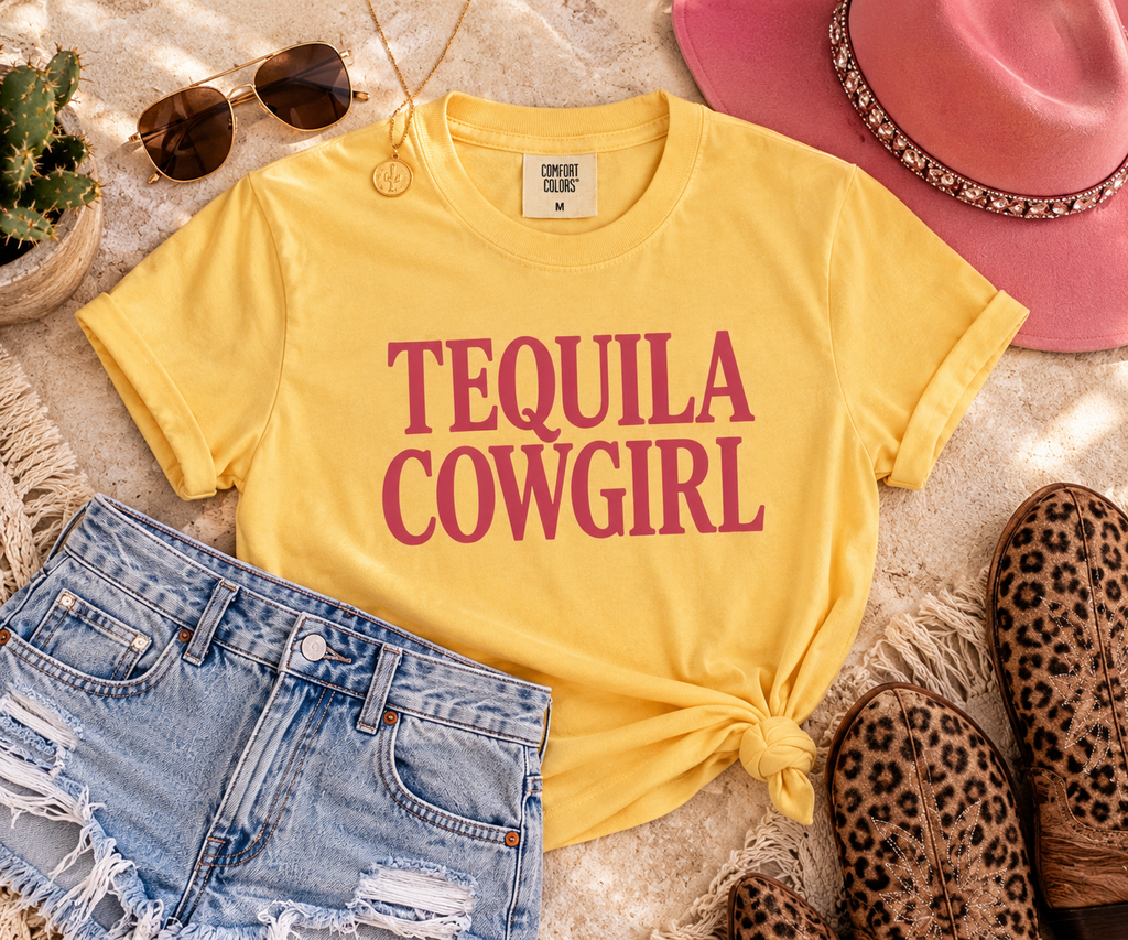 Tequila Cowgirl boxy tee styled in a Western-inspired flat lay with denim